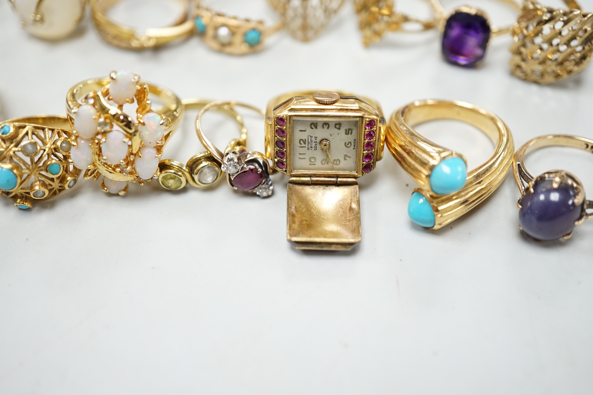 Three 18ct and gem set rings including star sapphire, turquoise and pearl and ruby and diamond three stone, five 9ct gold rings and a 9ct gold pendant mount and nine other rings including ring watch and Middle Eastern tu